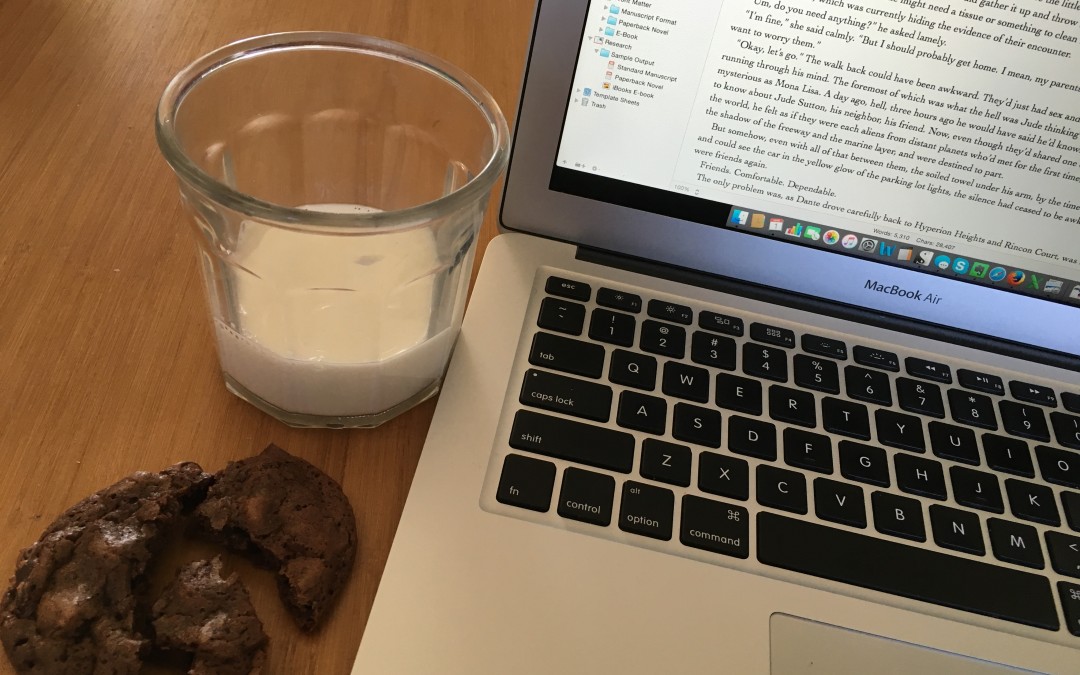 computer with cookie and milk